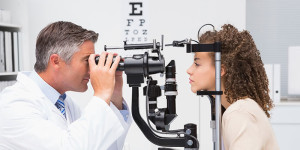 ophthalmologist giving a woman an eye exam