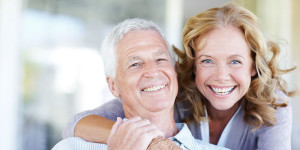 older couple smiling and hugging